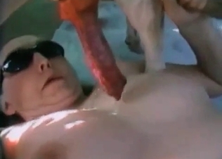 Watch her sucking an animal cock